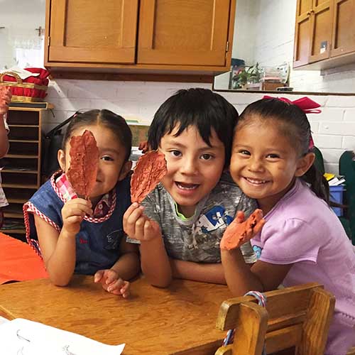 kids with clay leaves